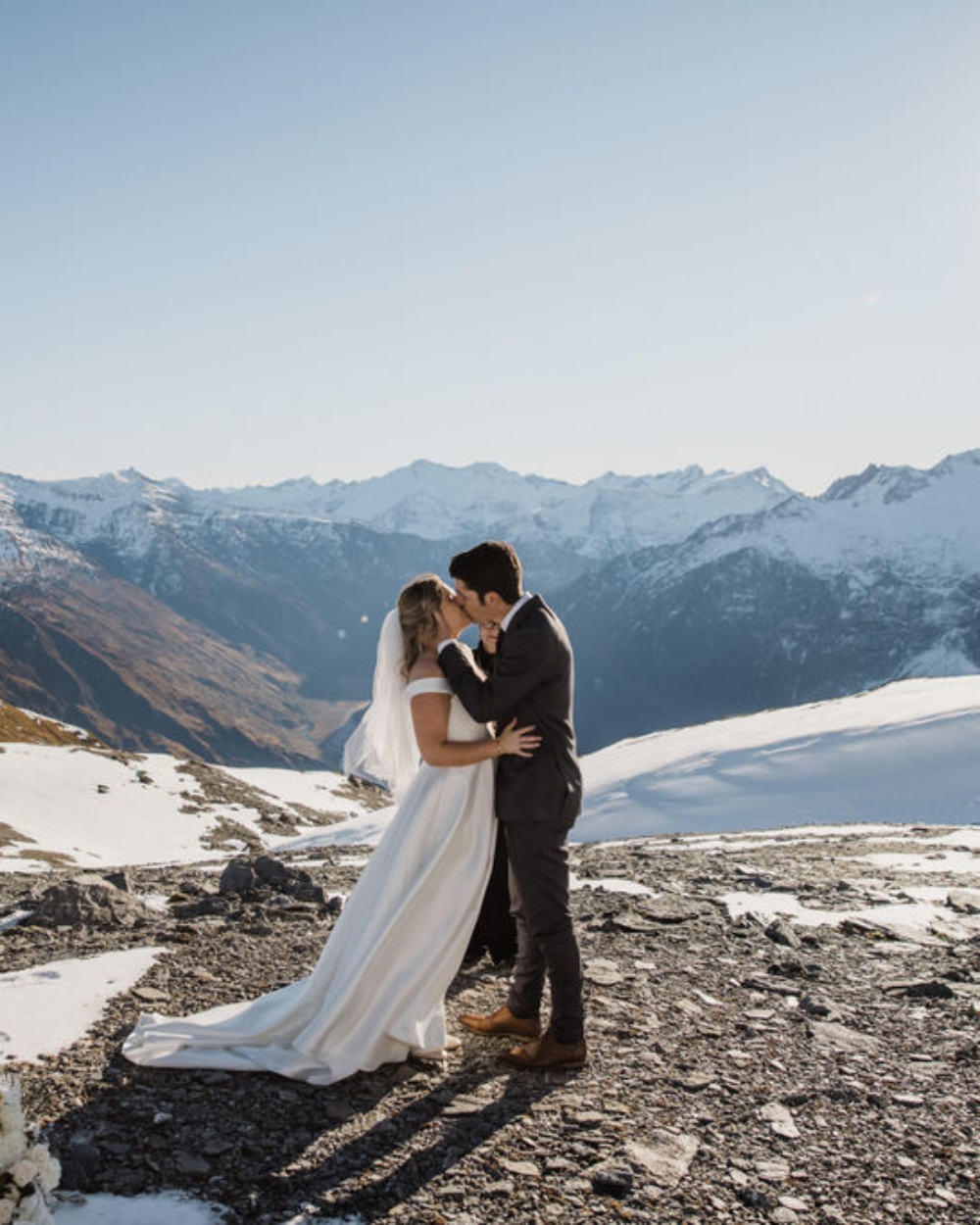 The Good Wedding Company Bride And Groom Kissing On Top Of A South Island Mountain Nz